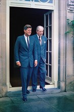 U.S. President John F. Kennedy and Prime Minister of Great Britain, Harold Macmillan, exit the