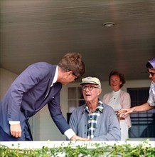 U.S. President John F. Kennedy visiting with his father, Ambassador Joseph P. Kennedy, Sr., on the