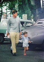 U.S. President John F. Kennedy and John F. Kennedy, Jr., departing toy store, Hyannis Port,