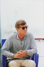 U.S. President John F. Kennedy sitting aboard Presidential yacht, “Honey Fitz,” during Labor Day