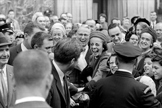 U.S. President John F. Kennedy greeting crowd after attending mass at St. Francis Xavier Chapel,