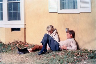 U.S. President John F. Kennedy visiting with family friend, Antoinette Bradlee, at Kennedy family