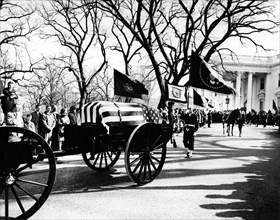 Funeral procession with flag-draped casket of U.S. President John F. Kennedy departing the White