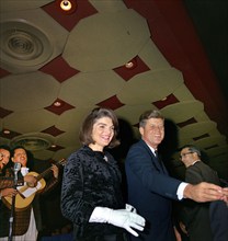 U.S. President John F. Kennedy and U.S. First Lady Jacqueline Kennedy greeting attendees at a