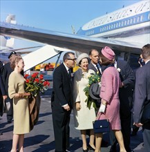 U.S. First Lady Jacqueline Kennedy  being greeted by (l-r): Elizabeth "Dearie" Cabell (with red