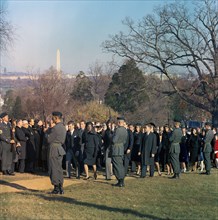 Members of the Kennedy family, led by Jacqueline Kennedy, U.S. Attorney General Robert F. Kennedy