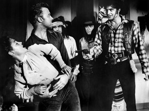 Morgan Jones (left), Joan Taylor (2nd left), Lance Fuller (right), on-set of the western film,