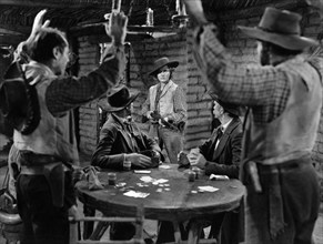 Jean Arthur (center with rifle), on-set of the western film, "Arizona", Columbia Pictures, 1940