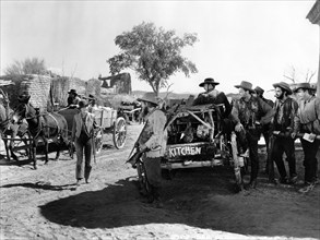 Jean Arthur (standing left with rifle), on-set of the western film, "Arizona", Columbia Pictures,