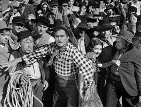 Leo Carrillo (foreground center), Jean Parker (right of Carrillo), on-set of the western film, "The