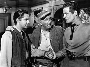 Jack Buetel, Walter Brennan, Robert Ryan, on-set of the western film, "Best Of The Badmen", RKO