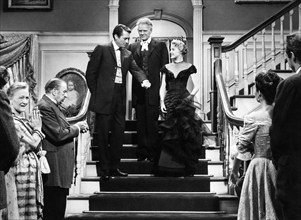 Gregory Peck (on stairs, left), Charles Bickford, (on stairs, center), Carroll Baker (on stairs,