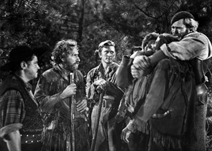 Arthur Hunnicutt (2nd left), Kirk Douglas (background center), on-set of the western film, "The Big