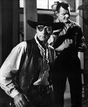 George Montgomery (foreground), Leo Gordon (rear), on-set of the western film, "Black Patch",