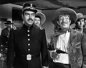 Pedro Armendariz (left), Alfonso Bedoya (right), on-set of the western film, "Border River",