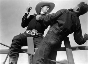 Bob Baker (left), on-set of the western film, "Border Wolves", Universal Pictures, 1938