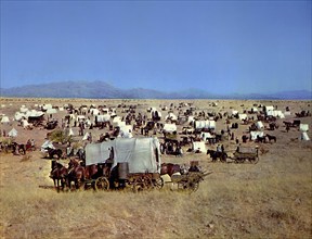 Covered wagons during Oklahoma land rush, on-set of the western film, "Cimarron", MGM, 1960