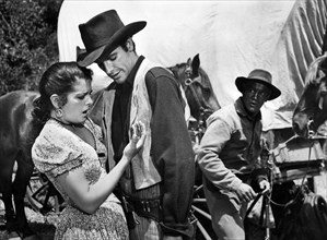 Beverly Tyler, James Best, on-set of the western film, "The Cimarron Kid", Universal Pictures, 1952