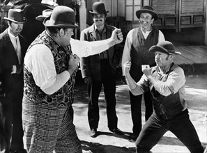 Dan Blocker (left), Mickey Rooney (right), on-set of the western film, "The Cockeyed Cowboys of