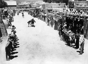 Cowboys doing horse-riding tricks, on-set of the western film, "Cowboy", Columbia Pictures, 1958