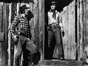 John Dehner,  George Montgomery, on-set of the western film, "Cripple Creek", Columbia Pictures,