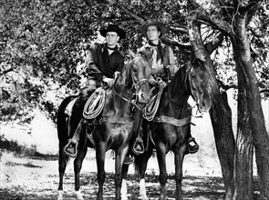 Jerome Courtland, George Montgomery, on-set of the western film, "Cripple Creek", Columbia