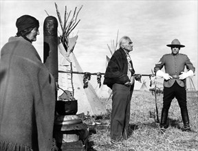 Chief Dan George (center), Kevin McCarthy (right), on-set of the western film, "Alien Thunder", aka