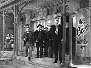 Edgar Buchanan (background, center), David Brian (right), on-set of the western film, "Dawn at