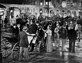 Susanna Foster (standing with hand extended next to horse-drawn carriage), on-set of the western