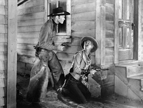 Leif Erickson, Irving Bacon, on-set of the western film, "Drift Fence", Paramount Pictures, 1936