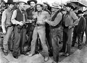 Audie Murphy (center), on-set of the western film, "Drums Across The River", Universal Pictures,