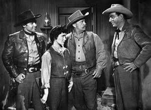 Audie Murphy (left), Susan Cabot, Walter Sande (2nd right), Stephen McNally (right), on-set of the