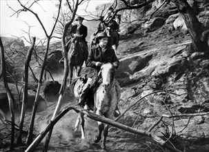 John Lund (foreground), on-set of the western film, "Five Guns West",  American Releasing