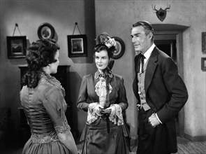 Phyllis Thaxter, Helena Carter, Randolph Scott, on-set of the western film, "Fort Worth", Warner