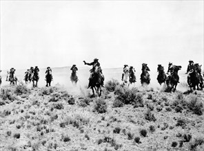 Charging U.S. Cavalry, on-set of the western film, "Fort Yuma", United Artists, 1955