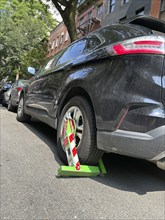 Wheel clamp device on rear car wheel