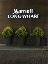 Marriott Hotel, Long Wharf, company sign on building exterior at night, Boston, Massachusetts, USA