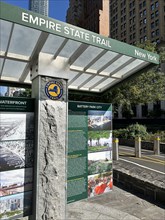 Urban bicycle path with information kiosk, Empire State Trail, Battery Park City, New York City,