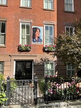 Harris Walz 2024 campaign poster on residential building, Greenwich Village, New York City, New