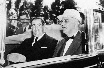 U.S. President Franklin D. Roosevelt and Mexican President Avila Camacho riding in convertible car,