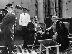 U.S. President Franklin D. Roosevelt and King Ibn Saud of Saudi Arabia aboard USS Quincy at Great