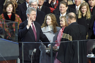 U.S. President Bill Clinton taking oath of office from Chief Justice William H. Rehnquist and is