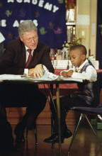 U.S. President Bill Clinton attending tutoring session with young boy, Jenner Elementary School,