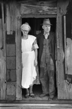 Mr. and Mrs. John Landers, tenant farmers, at backdoor of their farmhouse, near Marseilles,