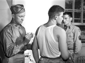 George Camblair getting his injections at reception center, Fort Belvoir, Virginia, USA, Jack