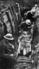 U.S. marine receiving first aid before being sent to hospital in rear of trenches. Toulon Sector,