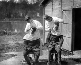 U.S. soldiers getting hair cut, 166th Field Hospital, Baccarat, France, U.S. Army Signal Corps, May