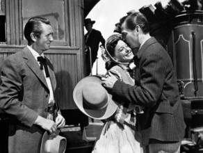 Macdonald Carey, Ellen Drew, Wendell Corey, on-set of the western film, "The Great Missouri Raid",