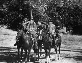 Boyd "Red" Morgan (being lynched), on-set of the western film, "Gunfighters of Abilene", United