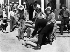 Robert J. Wilke (on ground), Johnny Cash (lifting Wilkie), Kirk Douglas (head partially obscured),